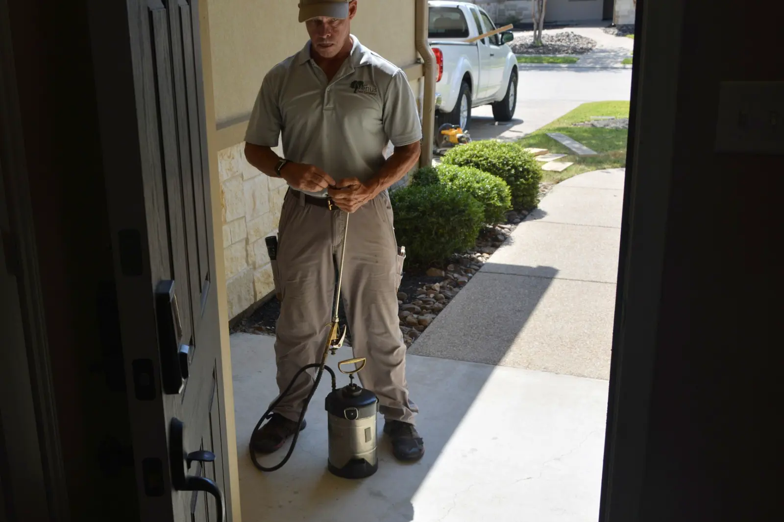 Venus Pest Company technician arriving to provide pest control at an Aggieland home