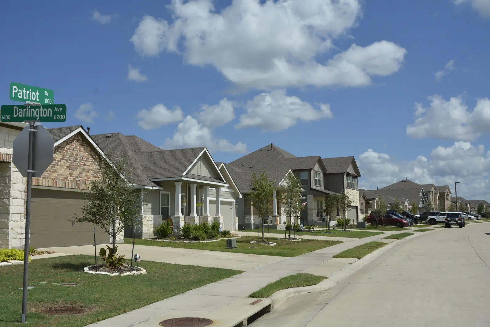Newer College Station neighborhood with slab homes and young landscaping